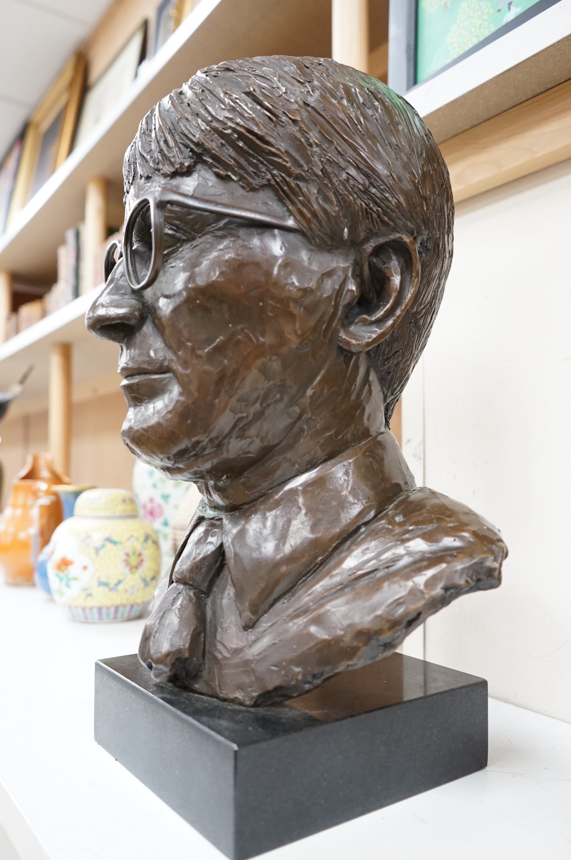 A bronze bust of a gentleman, raised on square base, unsigned, 44cm high. Condition - good